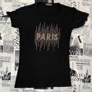 Attitude Paris Women's Black and Gold T-shirt y2k vintage